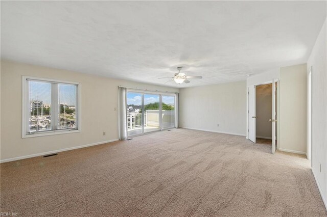 9489 Mooring Dr, Norfolk, VA 23518 - unfurnished room featuring ceiling fan, light carpet, and baseboards