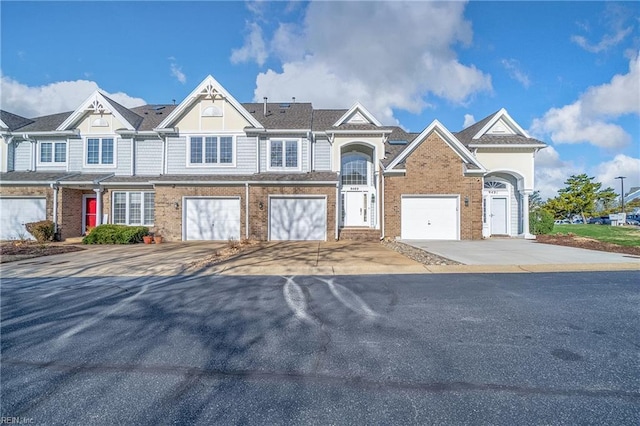 9489 Mooring Dr, Norfolk, VA 23518 - multi unit property featuring driveway, brick siding, and an attached garage