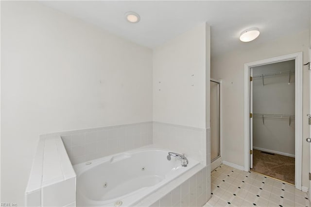 9489 Mooring Dr, Norfolk, VA 23518 - full bathroom featuring a shower stall, a jetted tub, a walk in closet, baseboards, and tile patterned flooring