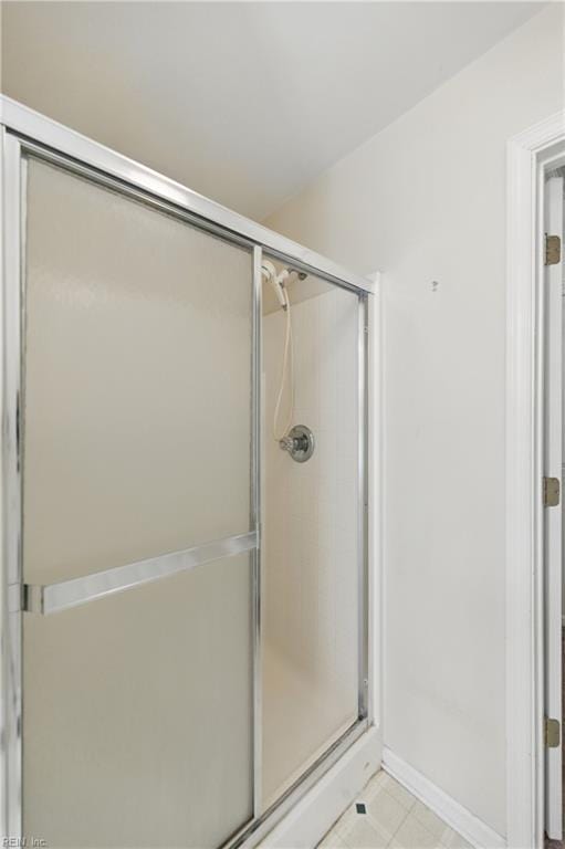 9489 Mooring Dr, Norfolk, VA 23518 - full bathroom featuring a shower with shower door and baseboards