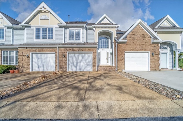 9489 Mooring Dr, Norfolk, VA 23518 - view of front facade featuring concrete driveway, brick siding, and an attached garage