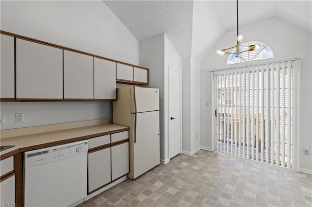 3566 Brigita Ct, Virginia Beach, VA 23453 - kitchen featuring white appliances, lofted ceiling, a chandelier, healthy amount of natural light, and white cabinets