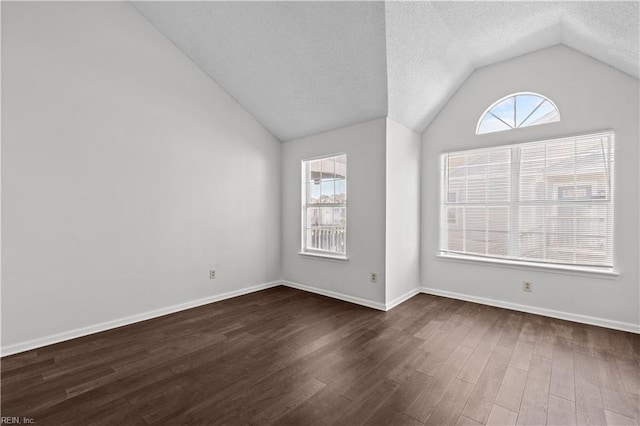 3566 Brigita Ct, Virginia Beach, VA 23453 - unfurnished room featuring vaulted ceiling, dark wood finished floors, baseboards, and a textured ceiling