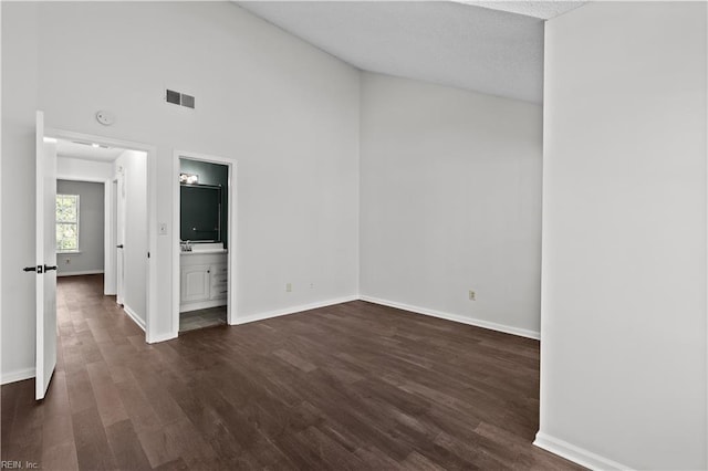 3566 Brigita Ct, Virginia Beach, VA 23453 - empty room featuring dark wood finished floors, baseboards, a smoke detector, and high vaulted ceiling