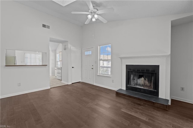 3566 Brigita Ct, Virginia Beach, VA 23453 - unfurnished living room with ceiling fan, a fireplace with raised hearth, wood finished floors, lofted ceiling, and baseboards