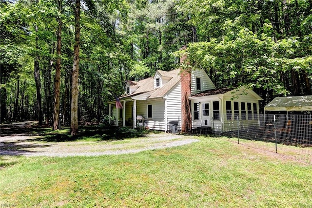 2944 Ridge Rd, Cobbs Creek, VA 23035 - view of side of property featuring a chimney and a yard