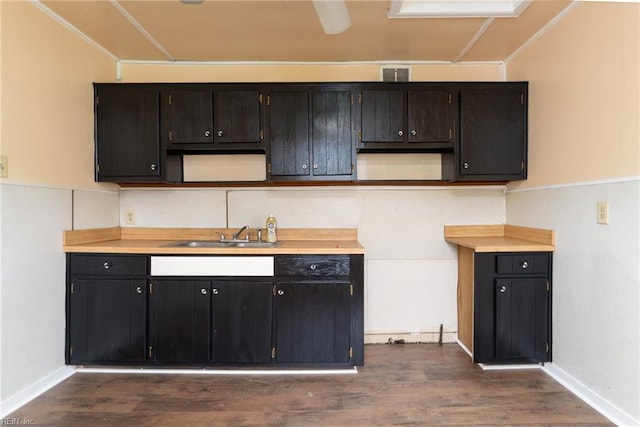 3302 Elliott Ave, Portsmouth, VA 23702 - kitchen featuring a sink, dark wood finished floors, baseboards, and light countertops