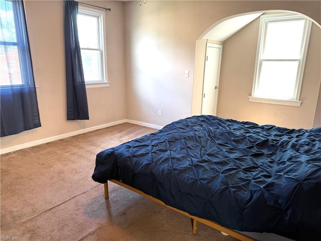 307 W 30th St, Norfolk, VA 23508 - bedroom featuring arched walkways, carpet flooring, and baseboards