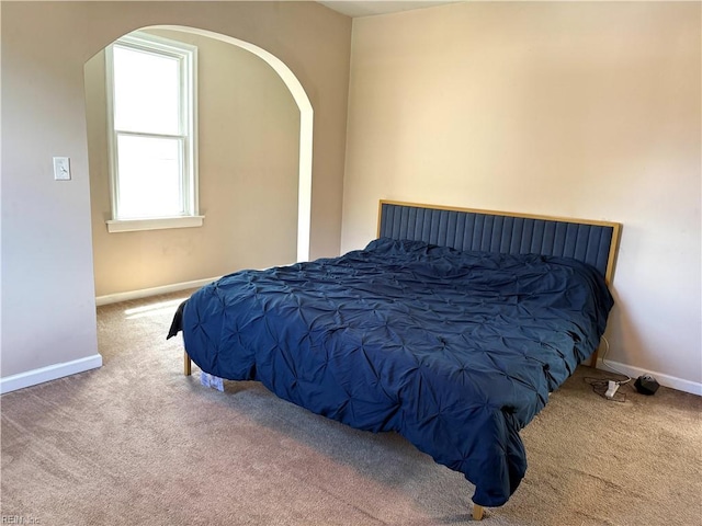 307 W 30th St, Norfolk, VA 23508 - bedroom with carpet, arched walkways, and baseboards