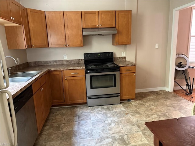 307 W 30th St, Norfolk, VA 23508 - kitchen with stainless steel appliances, under cabinet range hood, a sink, and brown cabinets