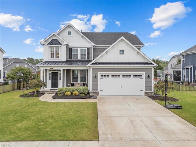 3012 George Starr Dr, Virginia Beach, VA 23456 - view of front of house with board and batten siding, a standing seam roof, concrete driveway, and a garage