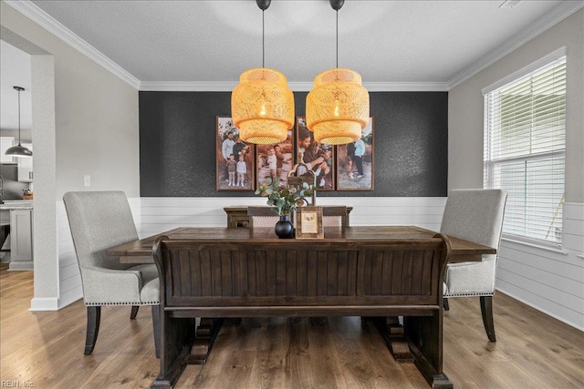 3012 George Starr Dr, Virginia Beach, VA 23456 - dining area with wood finished floors, ornamental molding, plenty of natural light, and a wainscoted wall