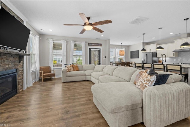 3012 George Starr Dr, Virginia Beach, VA 23456 - living room with ceiling fan, recessed lighting, dark wood-style floors, and a stone fireplace