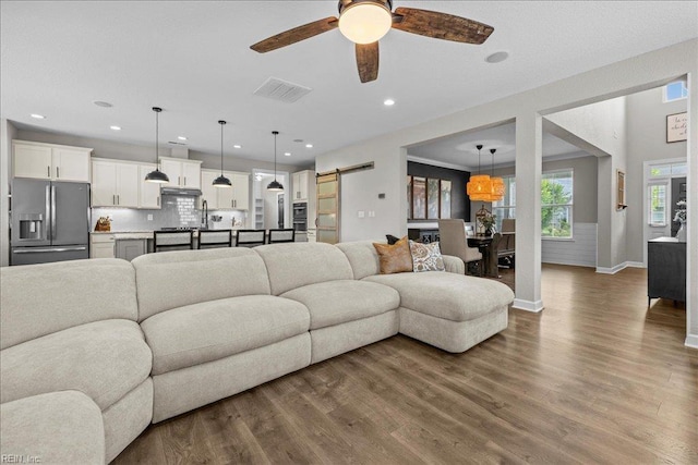 3012 George Starr Dr, Virginia Beach, VA 23456 - living room featuring a barn door, ceiling fan, dark wood finished floors, baseboards, and recessed lighting