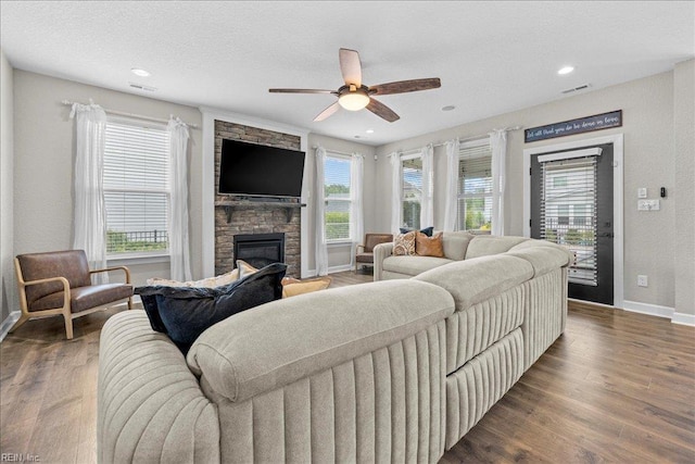 3012 George Starr Dr, Virginia Beach, VA 23456 - living area with a stone fireplace, baseboards, healthy amount of natural light, wood finished floors, and recessed lighting
