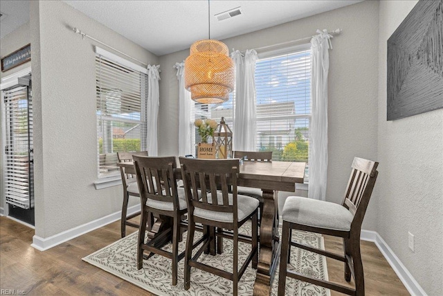 3012 George Starr Dr, Virginia Beach, VA 23456 - dining area featuring a textured wall, dark wood-style flooring, and baseboards
