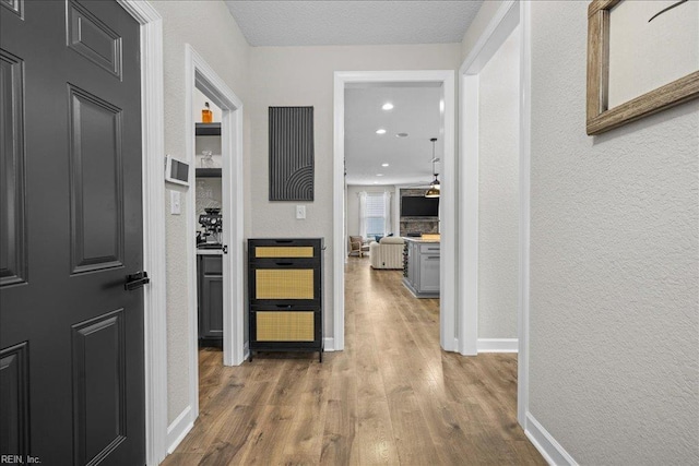 3012 George Starr Dr, Virginia Beach, VA 23456 - corridor with wood finished floors, baseboards, a textured wall, and recessed lighting
