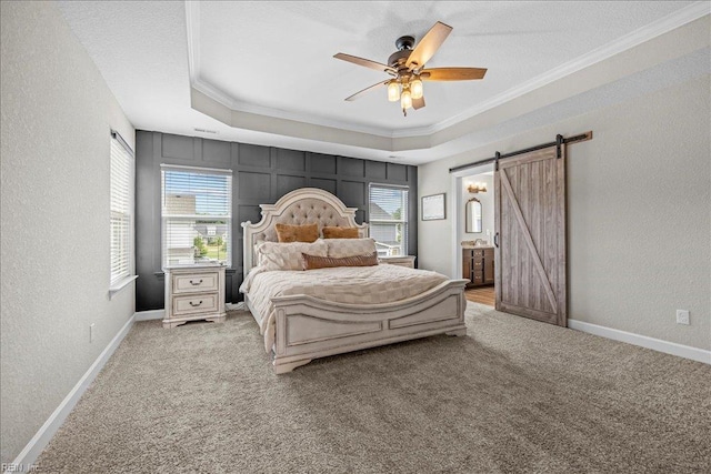 3012 George Starr Dr, Virginia Beach, VA 23456 - carpeted bedroom with crown molding, a barn door, multiple windows, a textured wall, and a raised ceiling