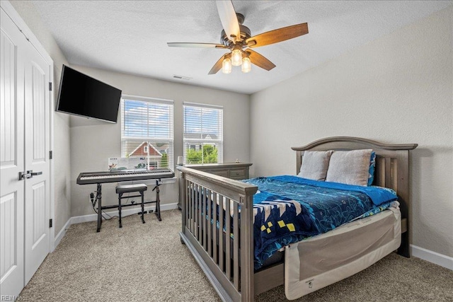 3012 George Starr Dr, Virginia Beach, VA 23456 - bedroom featuring baseboards, light colored carpet, a textured ceiling, and ceiling fan