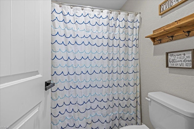 3012 George Starr Dr, Virginia Beach, VA 23456 - full bathroom with toilet, a shower with shower curtain, and a textured wall
