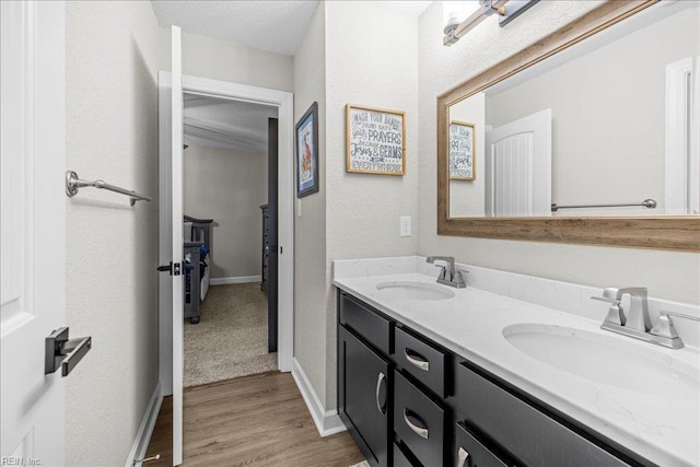 3012 George Starr Dr, Virginia Beach, VA 23456 - full bath featuring double vanity, wood finished floors, baseboards, and a textured wall