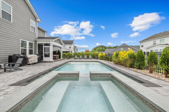 3012 George Starr Dr, Virginia Beach, VA 23456 - view of swimming pool featuring a sunroom, a patio, and a pool with connected hot tub