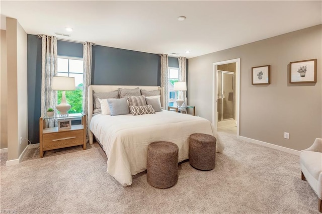 123 Getty Rd, Suffolk, VA 23434 - bedroom with multiple windows, light colored carpet, baseboards, recessed lighting, and connected bathroom