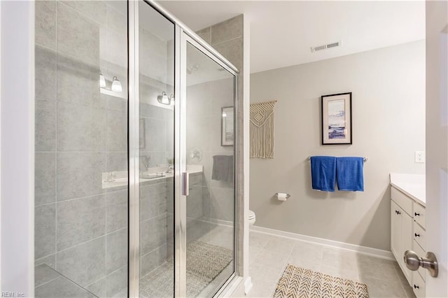 123 Getty Rd, Suffolk, VA 23434 - full bath featuring vanity, a stall shower, baseboards, tile patterned flooring, and toilet