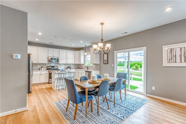 123 Getty Rd, Suffolk, VA 23434 - dining area featuring light wood-style flooring, a chandelier, baseboards, and recessed lighting