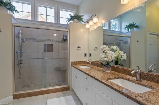 20185 Harbour Rdg, Smithfield, VA 23430 - full bathroom with double vanity, a shower stall, baseboards, and tile patterned flooring