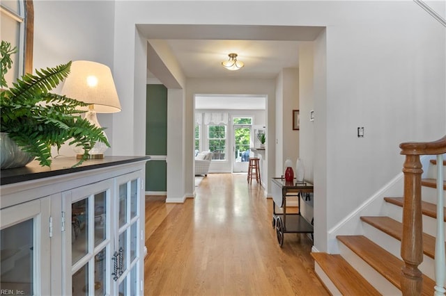 20185 Harbour Rdg, Smithfield, VA 23430 - entryway featuring light wood finished floors, stairway, baseboards, and french doors