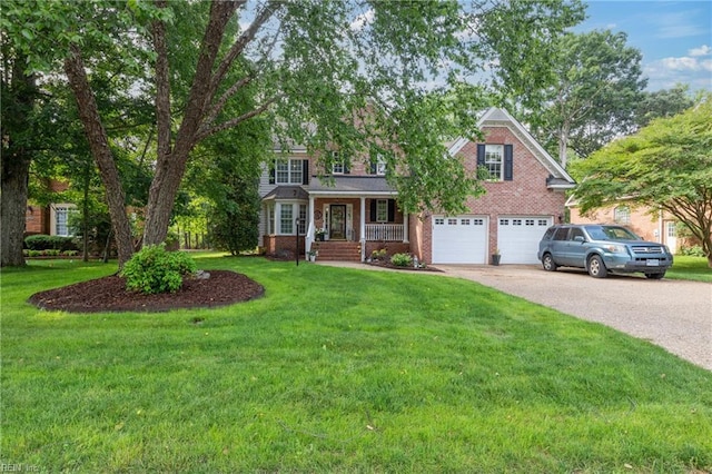 20185 Harbour Rdg, Smithfield, VA 23430 - view of front of home with covered porch, driveway, a garage, and brick siding
