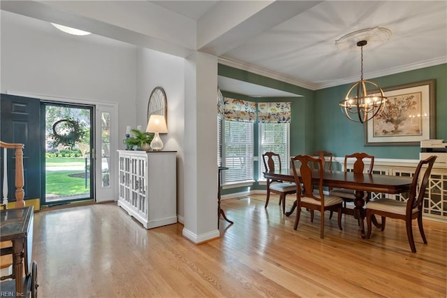 20185 Harbour Rdg, Smithfield, VA 23430 - dining area with a chandelier, light wood-type flooring, ornamental molding, and baseboards
