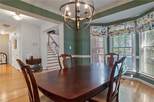 20185 Harbour Rdg, Smithfield, VA 23430 - dining space featuring stairway, light wood finished floors, plenty of natural light, a chandelier, and crown molding