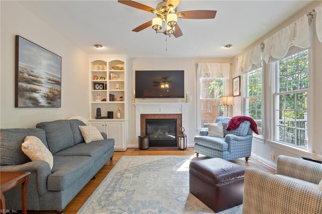 20185 Harbour Rdg, Smithfield, VA 23430 - living room featuring plenty of natural light, a fireplace, and wood finished floors