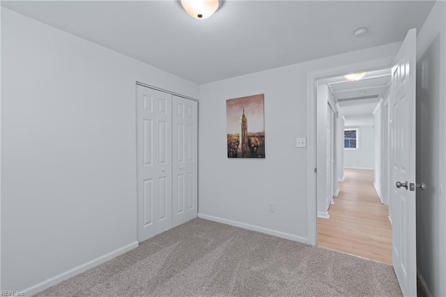 1215 Hale Dr, Hampton, VA 23663 - unfurnished bedroom with light carpet, a closet, and baseboards