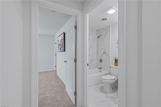 1215 Hale Dr, Hampton, VA 23663 - bathroom featuring toilet, washtub / shower combination, marble look tile flooring, and baseboards