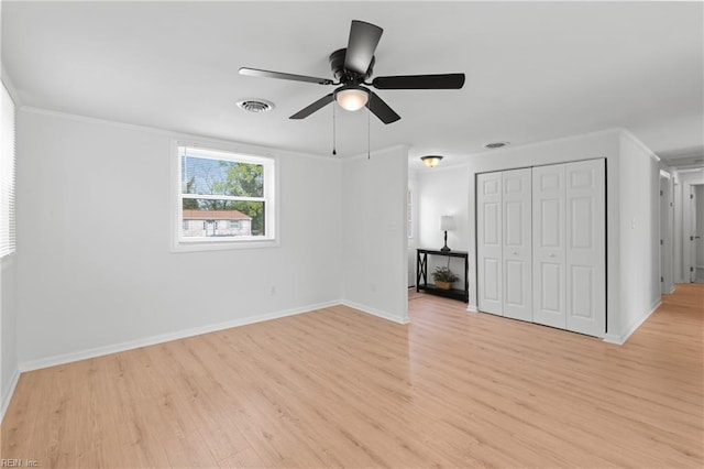 1215 Hale Dr, Hampton, VA 23663 - unfurnished bedroom with light wood finished floors, baseboards, ornamental molding, a closet, and ceiling fan