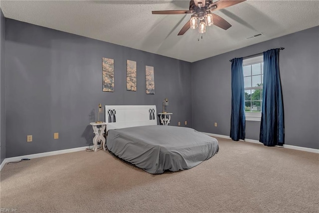 506 Everett Dr, Elizabeth City, NC 27909 - carpeted bedroom featuring a textured ceiling, baseboards, and ceiling fan