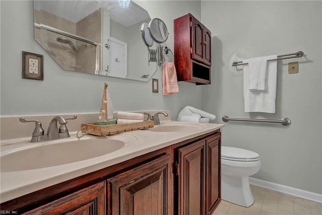506 Everett Dr, Elizabeth City, NC 27909 - full bath featuring double vanity, toilet, a shower, and baseboards