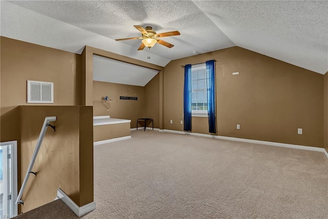 506 Everett Dr, Elizabeth City, NC 27909 - additional living space with ceiling fan, vaulted ceiling, carpet flooring, a textured ceiling, and baseboards