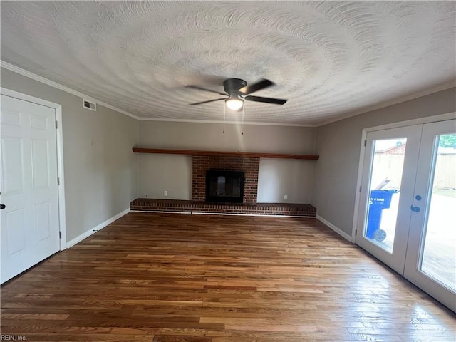 6217 Apple St, Suffolk, VA 23435 - unfurnished living room featuring french doors, plenty of natural light, ornamental molding, ceiling fan, and wood finished floors