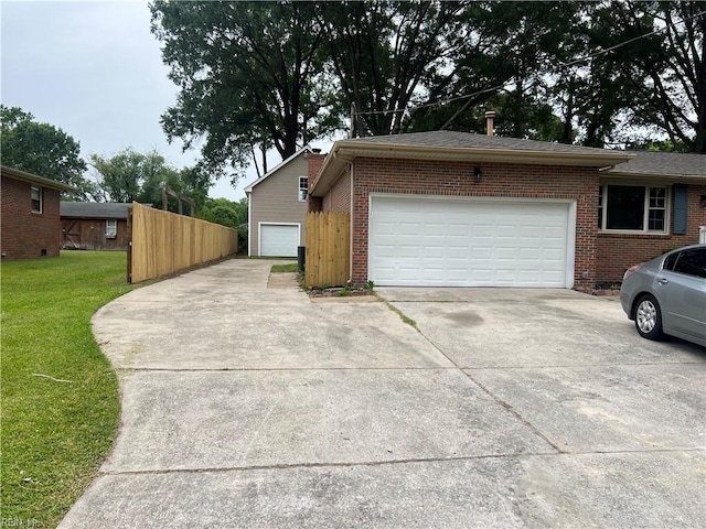 6217 Apple St, Suffolk, VA 23435 - view of home's exterior with brick siding, concrete driveway, and a garage