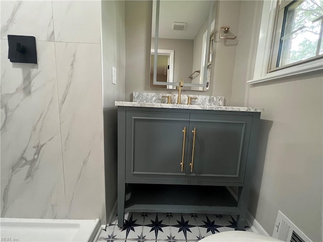 6217 Apple St, Suffolk, VA 23435 - bathroom with vanity, tile patterned floors, toilet, a marble finish shower, and baseboards