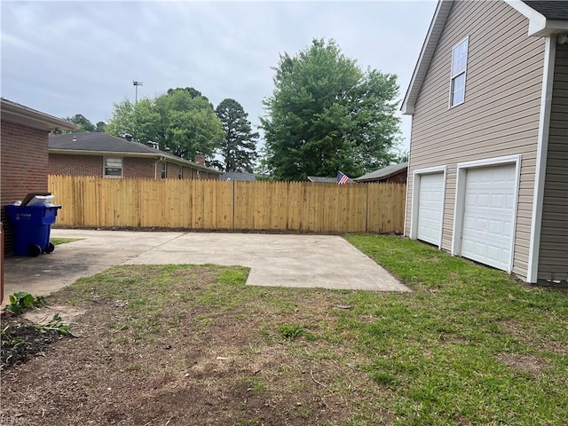 6217 Apple St, Suffolk, VA 23435 - view of yard with an attached garage and a patio