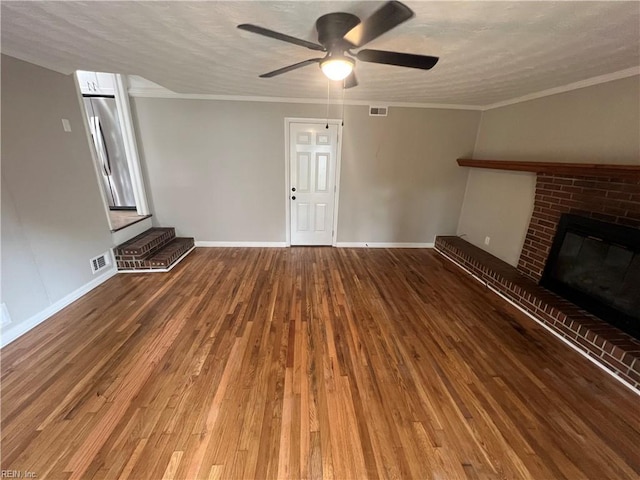 6217 Apple St, Suffolk, VA 23435 - unfurnished living room featuring ceiling fan, wood finished floors, baseboards, a brick fireplace, and ornamental molding