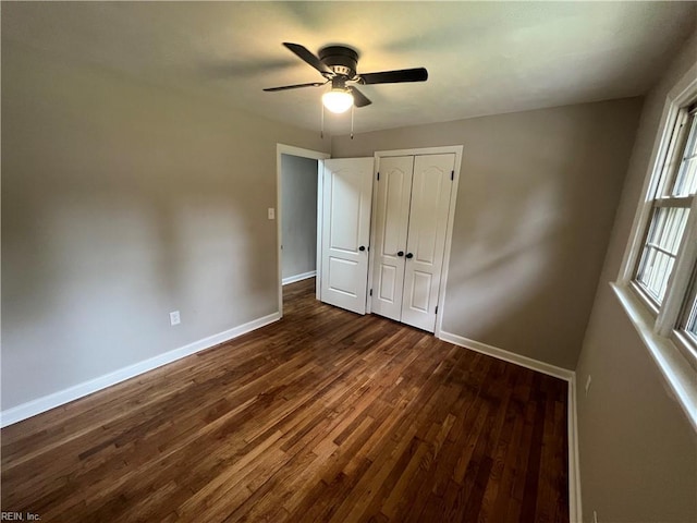 6217 Apple St, Suffolk, VA 23435 - unfurnished bedroom featuring baseboards, dark wood-style floors, a closet, and ceiling fan