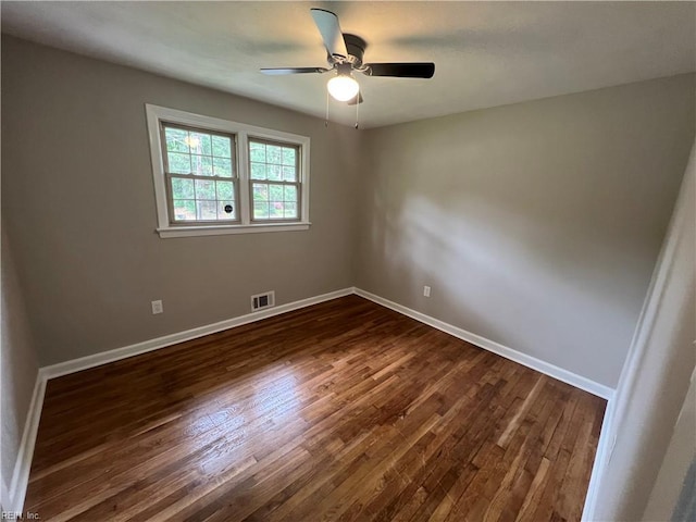 6217 Apple St, Suffolk, VA 23435 - unfurnished room featuring dark wood-type flooring, baseboards, and a ceiling fan