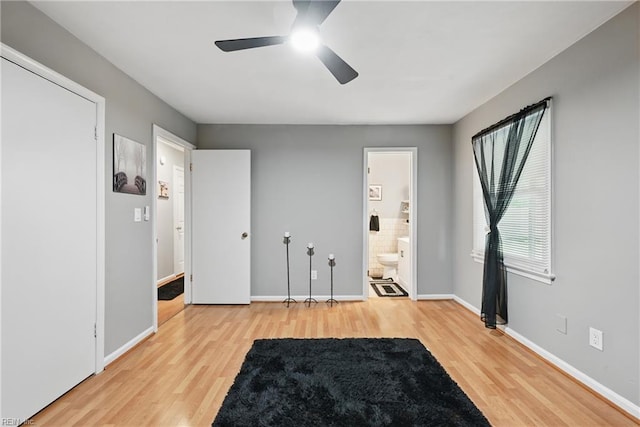 2405 Minnesota Ave, Norfolk, VA 23513 - unfurnished bedroom with wood finished floors, baseboards, connected bathroom, and a ceiling fan