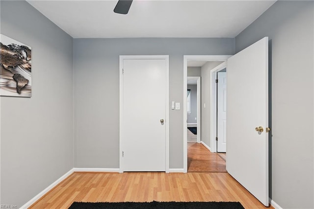 2405 Minnesota Ave, Norfolk, VA 23513 - unfurnished bedroom with light wood-style flooring, baseboards, and a ceiling fan